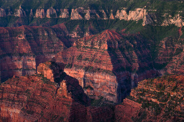 Sunrise looking into the Grand Canyon at the colorful rock formations of at Point Imperial on the...