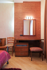 Mirror with table and chair in the bedroom