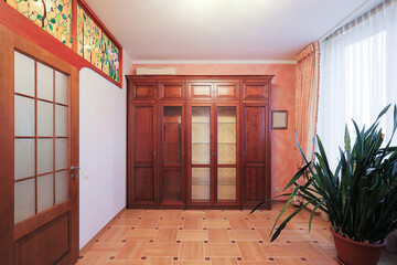 Classic wardrobe in the room interior