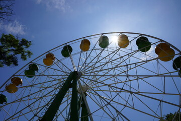 ferris wheel against blue sky