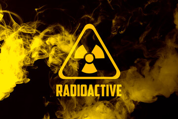 Radioactive sign and yellow toxic smoke against black background