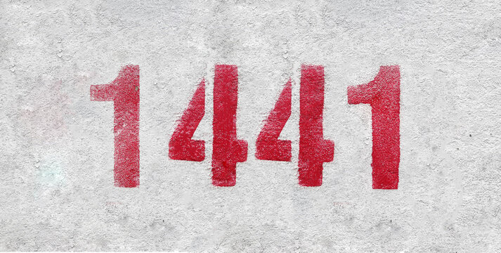 number 1441 . Red spray paint the white wall