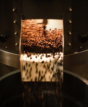 Coffee beans being roasted in a commercial coffee roaster