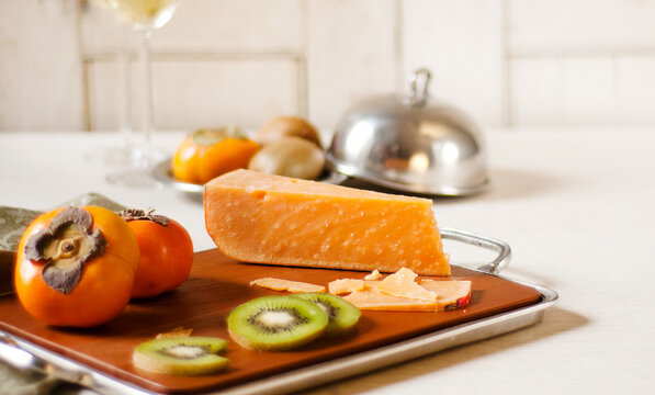 Mimolette cheese with kiwi and persimmon
