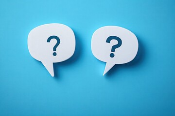 Two white speech bubbles with question marks inside on a bright blue background symbolizing inquiry and communication