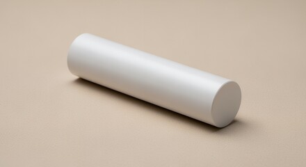 A pristine white cylindrical object rests on a neutral beige background, showcasing its smooth texture and simple elegance.