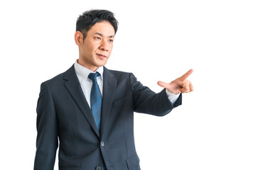 指差しするスーツ姿の中年の男性アジア人ビジネスマン（チャレンジ・前向き・アイデア・起業・希望）
