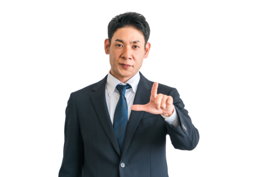 指差しするスーツ姿の中年の男性アジア人ビジネスマン（チャレンジ・前向き・アイデア・起業・希望）
