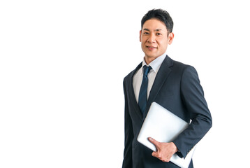 パソコン・ノートパソコンを持つスーツ姿の中年アジア人ビジネスマン
