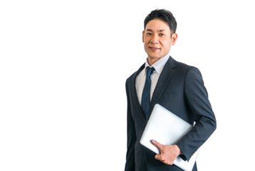 パソコン・ノートパソコンを持つスーツ姿の中年アジア人ビジネスマン