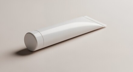 A pristine white tube of cream or lotion rests elegantly on a neutral background, showcasing its simple yet sophisticated design.