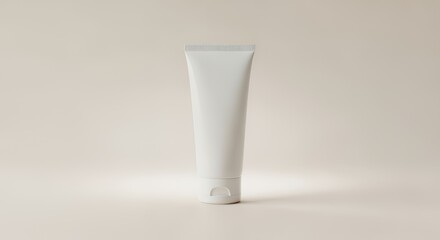 A pristine white tube of skincare cream or lotion stands on a pale yellow background, ready for your product photography needs.