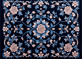 Ornate floral pattern with blue and white roses on dark background, showcasing intricate symmetrical design and elegant craftsmanship. detailed embroidery creates classic and timeless aesthetic