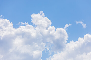 Sunny Mid-Afternoon Sky with Fluffy White Clouds.