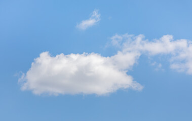 Fluffy White Clouds in a Clear Blue Sky. fair-weather cumulus