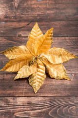 Velvety golden Christmas flower with soft texture and subtle glitter. Handmade festive decor for cozy holiday crafts and elegant seasonal compositions.