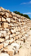 Ancient stone wall under a clear sky