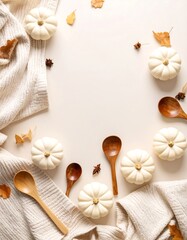 Autumnal frame with pumpkins, leaves, and wooden spoons