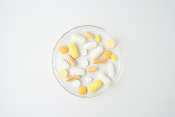 Clock made of pills capsules, pills form a circle, omega, vitamins, Cod liver oil, supplements