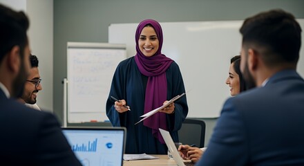 A confident businesswoman in a hijab leads a productive team meeting, sharing insights and fostering collaboration.
