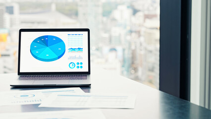 Fototapeta premium Documents and laptop in an urban office building