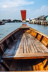 Wooden longtail boat on calm water thailand