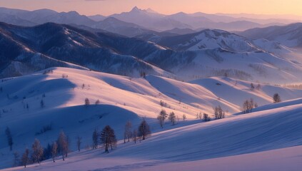 Snowy mountains at sunrise, bathed in soft light. Rolling hills dusted with snow, scattered trees, and distant peaks create a serene winter landscape