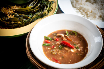 Shrimp paste chili dip, steamed rice, stir-fried morning glory with chili paste and omelet are...