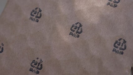 Cardboard packaging. PAP 21 logo printed on a cardboard, paper recycle, recycling symbols