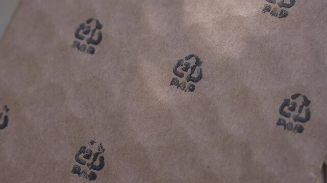 Cardboard packaging. PAP 21 logo printed on a cardboard, paper recycle, recycling symbols