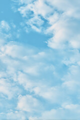 Fototapeta premium A view of a bright blue sky filled with fluffy white clouds today