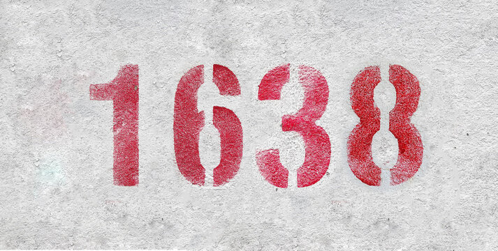 Red Number 1638 on the white wall. Spray paint.
