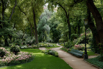 Fototapeta premium serene park in european capital city devoid of people showcasing lush greenery and vibrant flowers