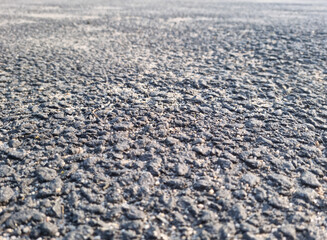 This is a close-up of an asphalt road.