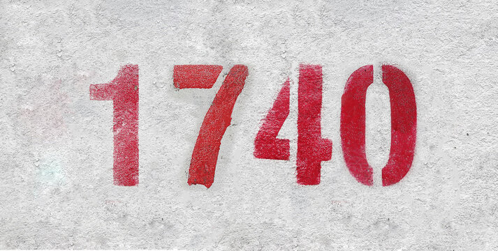 Red Number 1740 on the white wall. Spray paint.