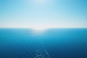 Obraz premium Endless expanse of calm ocean under a clear sky Perfect for travel, serenity, or nature-themed projects The horizon line dominates the image, creating a feeling of vastness and peace , flat, scenic