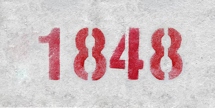 Red Number 1848 on the white wall. Spray paint.