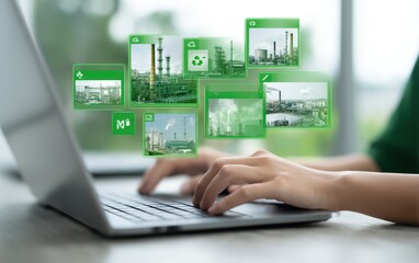 Person using laptop, viewing images of factory with environmental focus