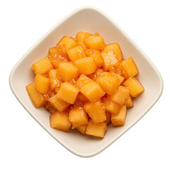 Freshly cut and glazed mango cubes served in a white bowl against a clean background