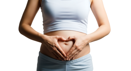 Young expectant mother with hands on hips, forming a heart shape over her baby bump, showing the beauty of pregnancy and the love for new life