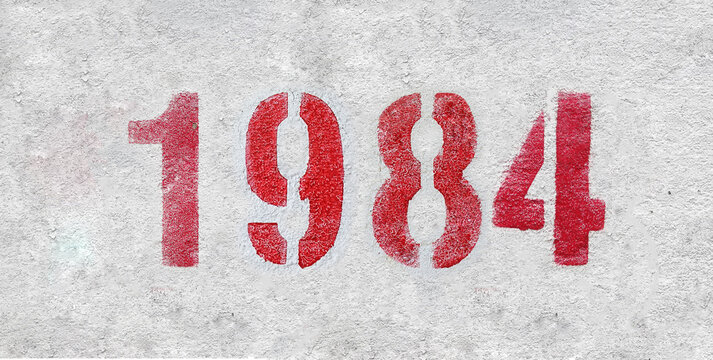 number 1984 . Red spray paint the white wall
