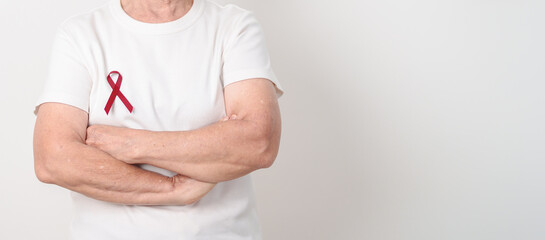 Elderly with Burgundy Ribbon for March Multiple Myeloma Cancer Awareness month, September Sickle Cell Anemia, Headache and Migraine week, April world Meningitis day, October Hospice Palliative care