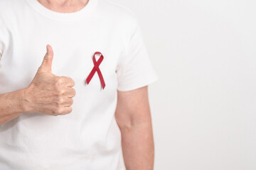 Elderly with Burgundy Ribbon for March Multiple Myeloma Cancer Awareness month, September Sickle Cell Anemia, Headache and Migraine week, April world Meningitis day, October Hospice  Palliative care