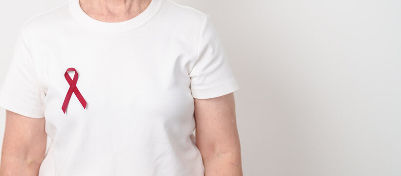 Elderly with Burgundy Ribbon for March Multiple Myeloma Cancer Awareness month, September Sickle Cell Anemia, Headache and Migraine week, April world Meningitis day, October Hospice Palliative care