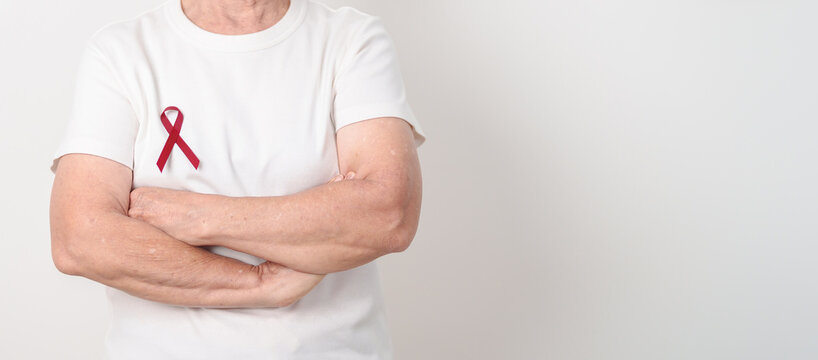Elderly with Burgundy Ribbon for March Multiple Myeloma Cancer Awareness month, September Sickle Cell Anemia, Headache and Migraine week, April world Meningitis day, October Hospice Palliative care