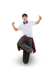 A young man in a stylish outfit, skillfully balancing on a skateboard, showcases his skateboarding...