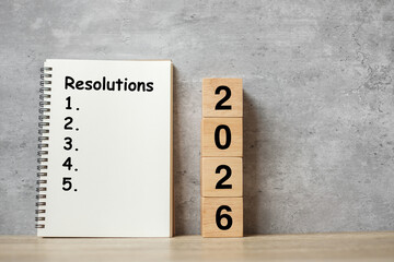 2026 Happy New Year with Resolution notebook and wooden number. countdown, Goals, Plan, Action and Mission Concept