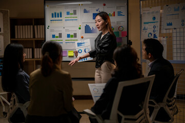 A woman is giving a presentation to a group of people
