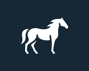 Obraz premium Elegant Horse Vector Silhouette on Dark Blue Background