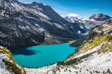 Oeschinensee lake and autumn snowy scenery in background, Kandersteg, Switzerland